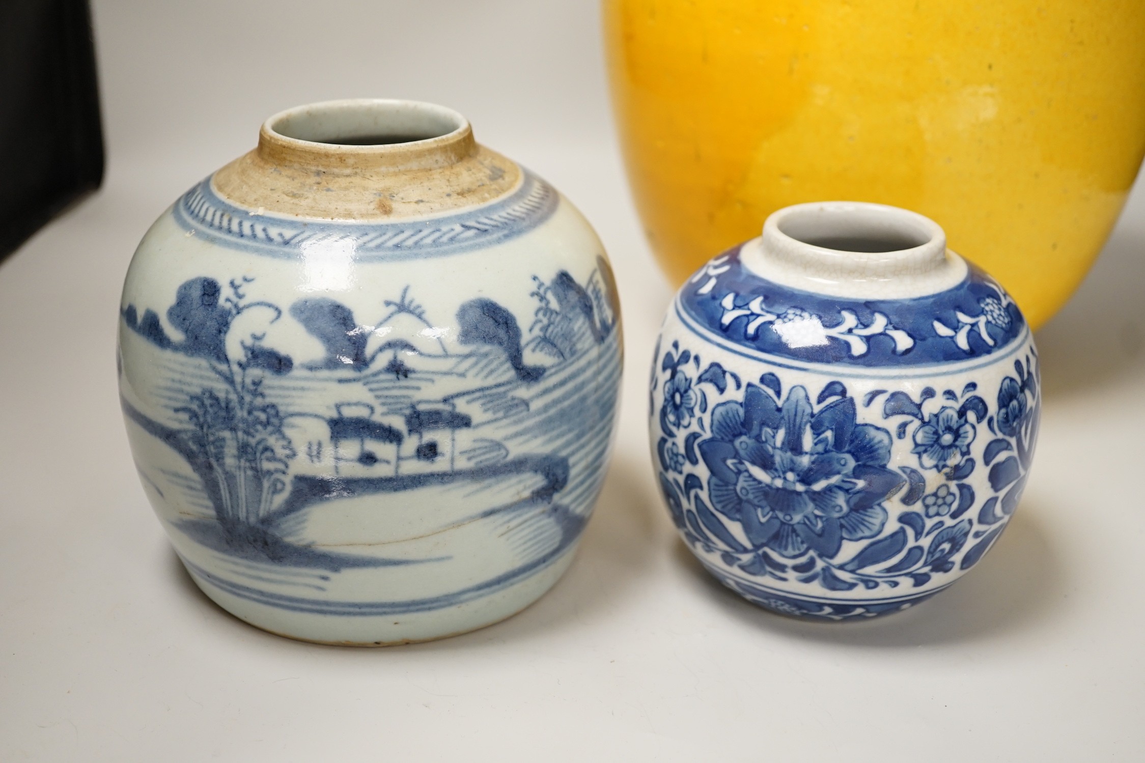 Two Chinese blue and white ginger jars, together with a large Chinese yellow glazed vase, tallest 31cm